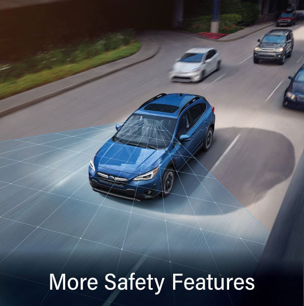 A Subaru Crosstrek in blue with the words “More Safety Features“. | Valley Subaru of Longmont in Longmont CO