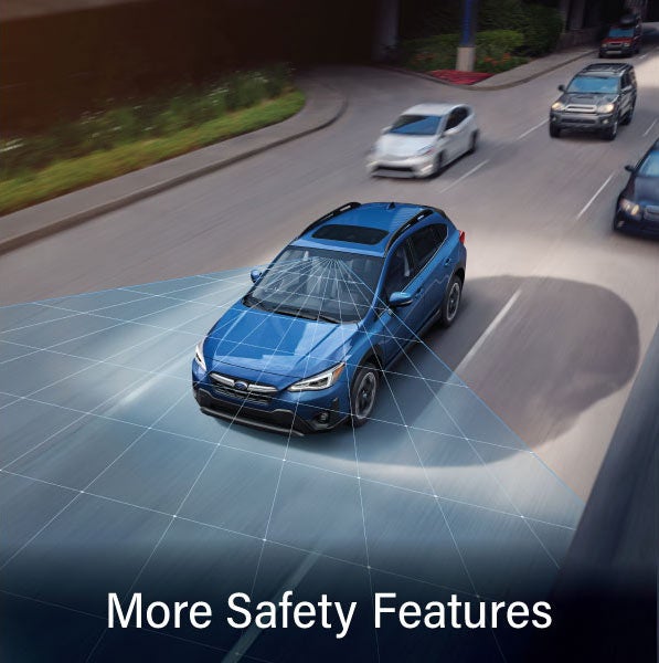 A Subaru Crosstrek in blue with the words &ldquo;More Safety Features&ldquo;. | Valley Subaru of Longmont in Longmont CO