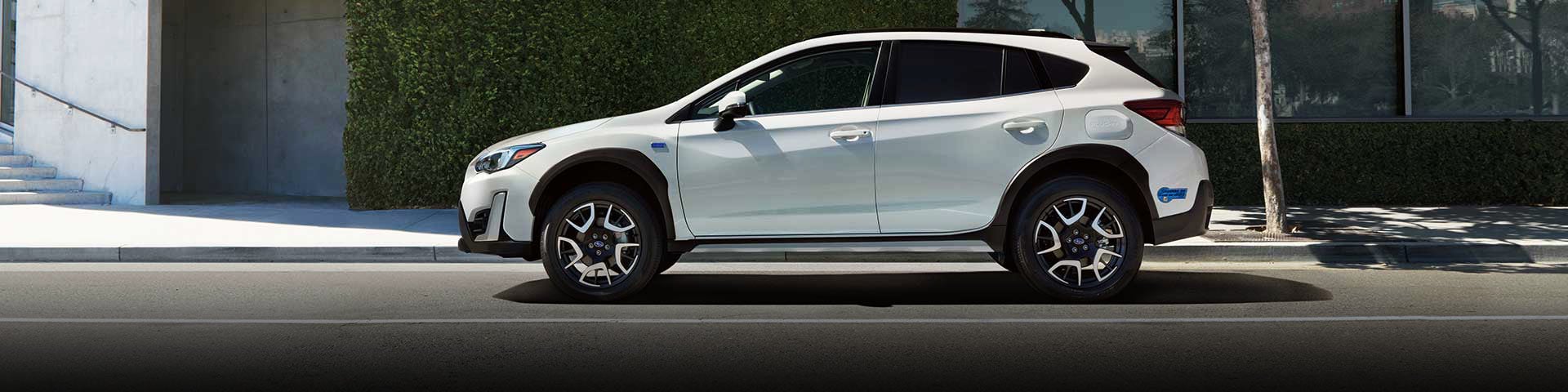 The side profile of a white Subaru Crosstrek Hybrid | Valley Subaru of Longmont in Longmont CO