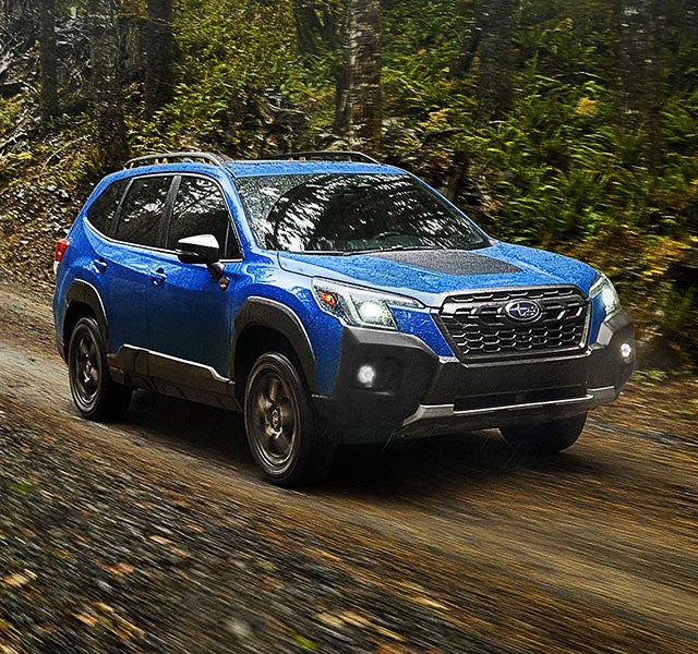 A 2022 Forester driving on a highway. | Valley Subaru of Longmont in Longmont CO